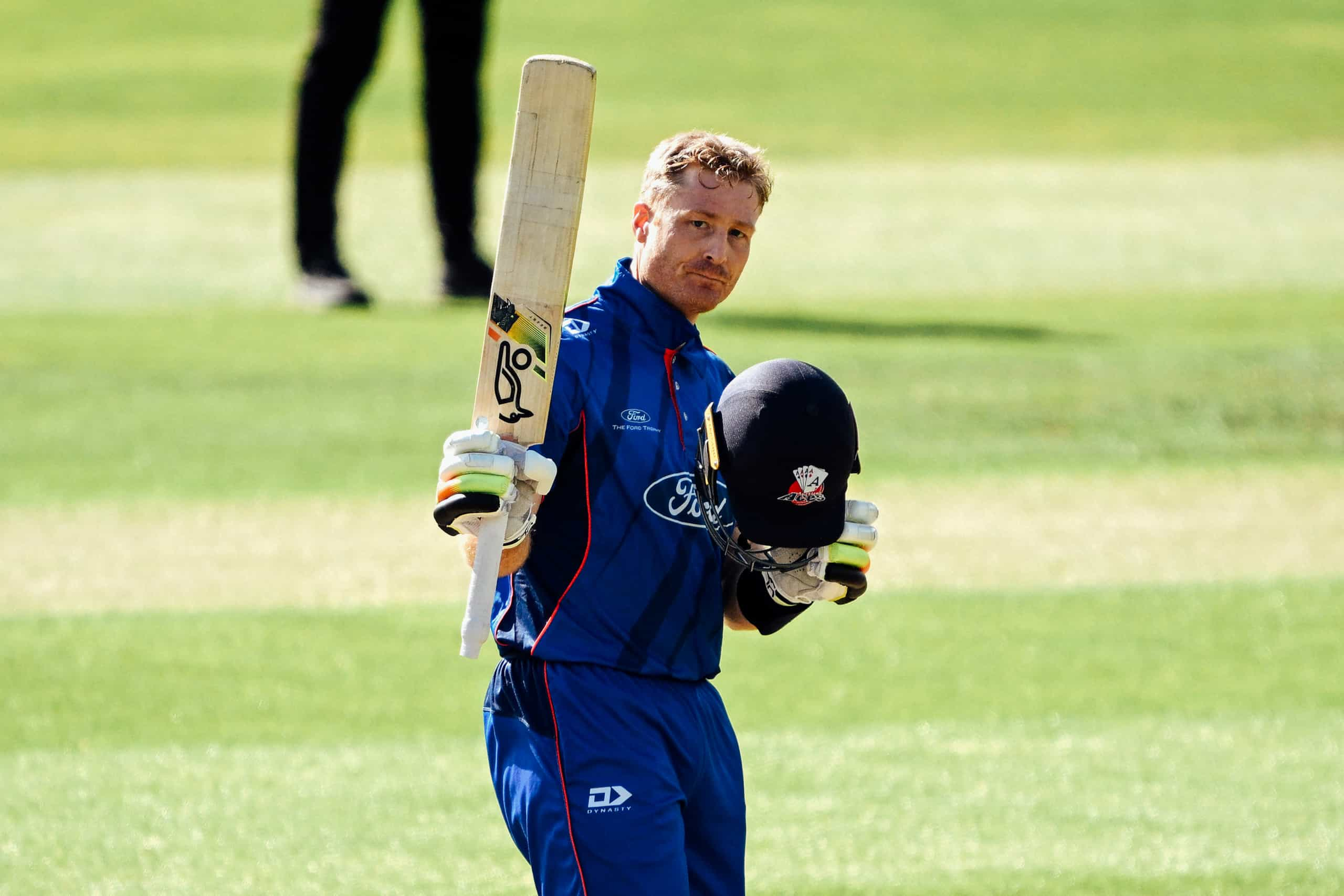 Martin Guptill of Auckland raises his bat after scoring a century during the Ford Trophy Elimination Final between the Otago Volts and the Auckland Aces at University of Otago Oval on the 21st of February 2024, in Dunedin, New Zealand. (Image by Joe Allison / Photosport)