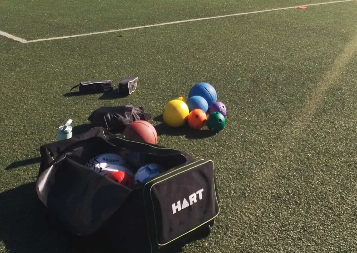 Blind Sport Kit on turf with sun shining about to set up Goalball training