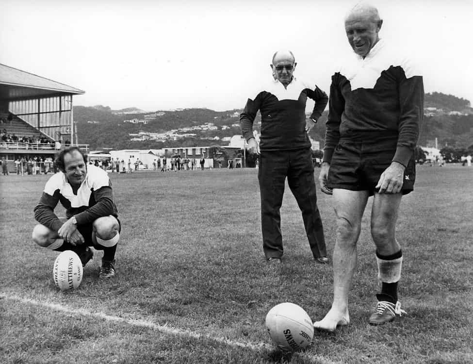 Bob Scott shows off his barefoot goalkicking skills during Petone celebrations (1970s). With Scott are Fergie McCormick (left) and legendary South African Okey Geffin.